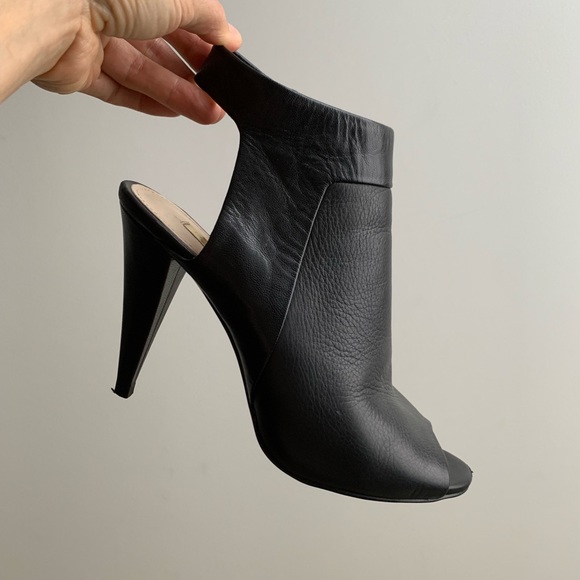 Louise et Cie Shoes - Heeled black bootie with cut outs. Louise et Cie Shoes - Heeled black bootie with cut outs.